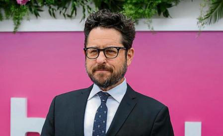 (FILES) This file photo taken on May 3, 2017 shows Director J.J. Abrams attending the Hulu Upfront Brunch at La Sirena Ristorante in New York City. Abrams is to direct 