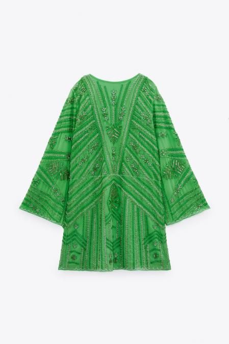 Vestido túnica con abalorios.