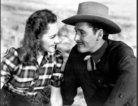 Con su compañera de aventuras cinematográficas Olivia de Havilland