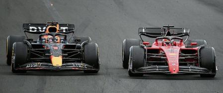 Red Bull Racing's Dutch driver Max Verstappen (L) and Ferrari's Monegasque driver Charles Leclerc compete during the Formula One Hungarian Grand Prix at the Hungaroring in Mogyorod near Budapest, Hungary, on July 31, 2022. (Photo by Ferenc ISZA / AFP)