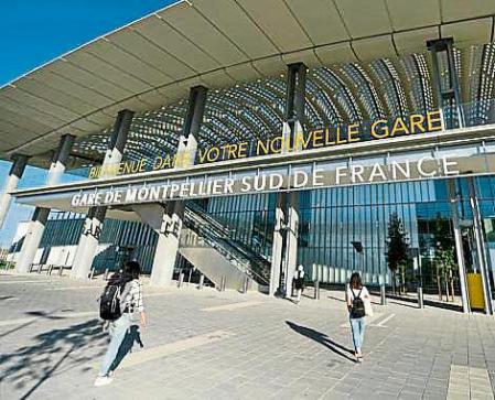 Tourists arrive on September 2, 2018 at the new TGV station of Montpellier in the south of France. (Photo by PASCAL GUYOT / AFP)