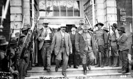MEXICO - CIRCA 1914: Pancho Villa (1878 - 1928) walks down the steps of a building after having discussions with General Fierro and General Scott, ca.1914. (Photo by Transcendental Graphics/Getty Images)