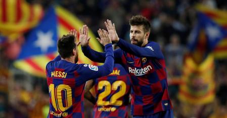 FILE PHOTO: Soccer Football - La Liga Santander - FC Barcelona v Real Valladolid - Camp Nou, Barcelona, Spain - October 29, 2019  Barcelona's Lionel Messi celebrates scoring their third goal with Gerard Pique   REUTERS/Albert Gea/File Photo