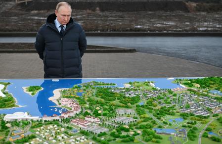 Russian President Vladimir Putin listens to explanations as he visits a transport hub under construction at a resort in the Tver region, Russia November 7, 2022. Sputnik/Maxim Blinov/Pool via REUTERS