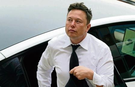 FILE - Elon Musk arrives at the justice center in Wilmington, Del., Tuesday, July 13, 2021. According to a filing posted late Wednesday, Dec. 14, 2022, by the U.S. Securities and Exchange Commission, Musk sold another $3.58 billion worth of Tesla stock during the week, but it wasn’t clear where the proceeds were being spent. Musk has sold nearly $23 billion worth of Tesla stock since April, with much of the money likely going to help fund his $44 billion acquisition of Twitter. (AP Photo/Matt Rourke, File)