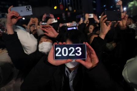 People celebrate New Year's eve in Seoul, South Korea, January 1, 2023. REUTERS/Kim Hong-Ji