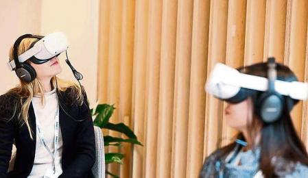 People use Meta Quest VR headset at the Meta showroom in Brussels on December 07, 2022. (Photo by Kenzo TRIBOUILLARD / AFP)