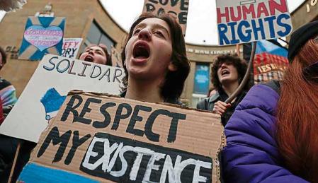 GLASGOW, SCOTLAND - JANUARY 21: Trans rights demonstrators attend a rally on Buchanan Street on January 21, 2023 in Glasgow, Scotland. Rishi Sunak announced this week that the UK government will use a Section 35 order to block Scotland's recent Gender Recognition Reform Bill on the grounds that it will impede the operation of the UK Equality Act. (Photo by Jeff J Mitchell/Getty Images)