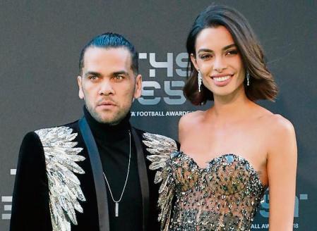 Brazilian soccer player Dani Alves and his wife Joana Sanz arrive for the ceremony of the Best FIFA Football Awards in the Royal Festival Hall in London, Britain, Monday, Sept. 24, 2018. (AP Photo/Frank Augstein)
