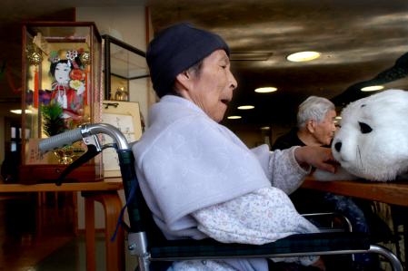 photograph by xavier cervera 02/2007 helping robot (bringing handbag and driving visitor or patient to the lift) at the ground floor of central hospital in aizu-wakamatsu, north japan