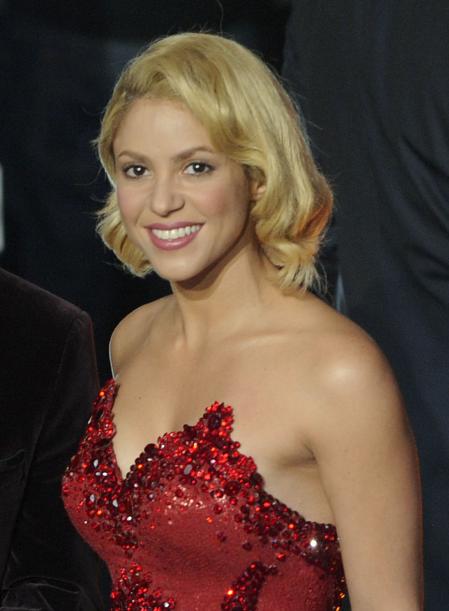 Lionel Messi stands next to Singer Shakira after he was awarded the prize for the soccer player of the year 2011 at the FIFA Ballon d'Or awarding ceremony in Zurich, Switzerland, Monday, Jan. 9, 2012.