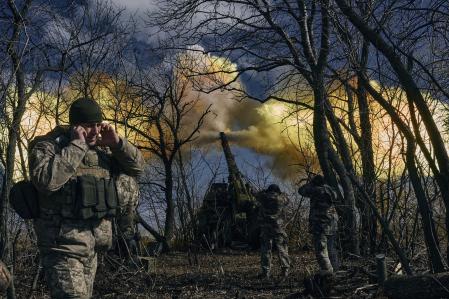 Ukrainian soldiers fire a self-propelled howitzer towards Russian positions near Bakhmut, Donetsk region, Ukraine, Sunday, March 5, 2023. (AP Photo/Libkos)