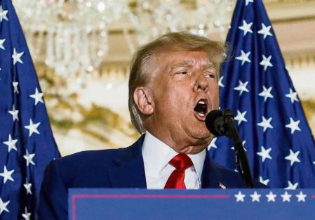 Former U.S. President Donald Trump delivers remarks on the day of his court appearance in New York after being indicted by a Manhattan grand jury following a probe into hush money paid to porn star Stormy Daniels, in Palm Beach, Florida, U.S., April 4, 2023. REUTERS/Marco Bello