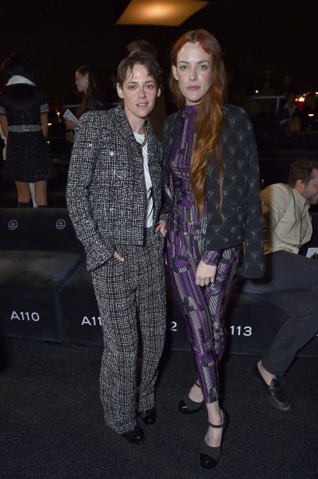 Kristen Stewart, left, and Riley Keough attend the Chanel Cruise 2023/2024 Fashion Show on Tuesday, May 9, 2023, at Paramount Studios in Los Angeles. (Photo by Jordan Strauss/Invision/AP)