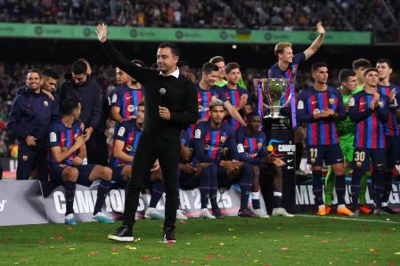 BARCELONA, SPAIN - MAY 20: Xavi, Head Coach of FC Barcelona, speaks in a presentation following receiving the LaLiga trophy after the LaLiga Santander match between FC Barcelona and Real Sociedad at Spotify Camp Nou on May 20, 2023 in Barcelona, Spain. (Photo by Alex Caparros/Getty Images)