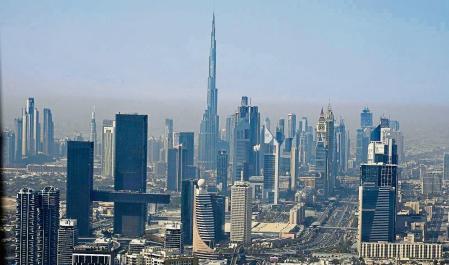 The skyline of Dubai, United Arab Emirates, with the world's tallest building the Burj Khalifa, is seen Friday, May 19, 2023. (AP Photo/Jon Gambrell)