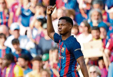 Barcelona's Ansu Fati celebrates after scoring his side's second goal during a Spanish La Liga soccer match between Barcelona and Mallorca at the Camp Nou stadium in Barcelona, Spain, Sunday, May 28, 2023. (AP Photo/Joan Monfort)