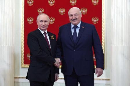 (FILES) Russian President Vladimir Putin greets Belarus' President Alexander Lukashenko at the Kremlin prior to the Victory Day military parade in central Moscow on May 9, 2023. The chief of the rebel Wagner mercenary force, Yevgeny Prigozhin, will leave Russia and won't face charges after calling off his troops' advance on June 24, 2023,  Moscow said, easing Russia's most serious security crisis in decades. Belarusian leader Alexander Lukashenko said he had negotiated a truce with Prigozhin, drawing thanks from Moscow. (Photo by Vladimir Smirnov / SPUTNIK / AFP)