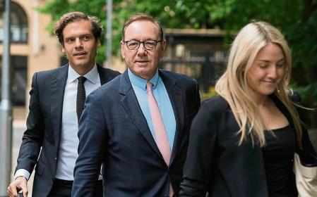 Actor Kevin Spacey, centre, arrives at Southwark Crown Court for the start of his trial in London, Wednesday, June 28, 2023. Spacey is going on trial on charges he sexually assaulted four men as long as two decades ago. The double-Oscar winner faces a dozen charges as his trial begins Wednesday at Southwark Crown Court. (AP Photo/Frank Augstein)