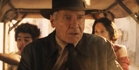 This image released by Lucasfilm shows Ethann Isidore, from left, Harrison Ford and Phoebe Waller-Bridge in a scene from 