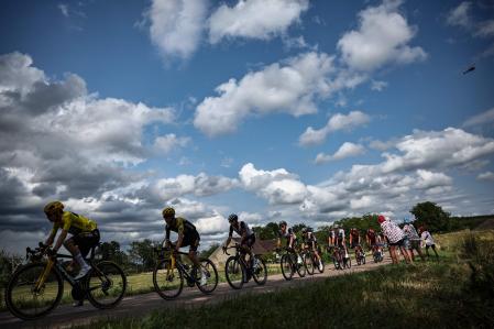 Jumbo-Visma's Danish rider Jonas Vingegaard wearing the overall leader's yellow jersey cycles ahead of the pack of riders during the 19th stage of the 110th edition of the Tour de France cycling race 173 km between Moirans-en-Montagne and Poligny, in the Jura department of central-eastern France, on July 21, 2023. (Photo by Anne-Christine POUJOULAT / AFP)