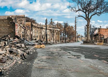 TOPSHOT - This handout image courtesy of the US Army shows damaged buildings and structures of Lahaina Town destroyed in the Maui wildfires in Lahaina, Maui, August 15, 2023. Members of Combined Joint Task Force-50 from the Hawaii Army and Air National Guard, US Army Active Duty and Reserve are supporting the community of Maui and first responders. The number of people known to have died in the horrific wildfire that levelled a Hawaiian town reached 106 on August 15, authorities said, as a makeshift morgue was expanded to deal with the tragedy. US President Joe Biden will head to fire-ravaged Hawaii on August 21 to meet with survivors and first responders still hunting for victims, the White House said on August 16. (Photo by Staff Sergeant Matthew A. Foster / DVIDS / AFP) / RESTRICTED TO EDITORIAL USE - MANDATORY CREDIT 