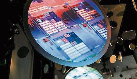 Images of semiconductor wafers at the Taiwan Semiconductor Manufacturing Co. (TSMC) Museum of Innovation in Hsinchu, on Tuesday, Jan. 11, 2022. TSMC reported a sixth straight quarter of record sales, buoyed by unrelenting demand by Apple Inc. and other customers for chips produced by the world#{emoji}146;s largest foundry. Photographer: I-Hwa Cheng/Bloomberg