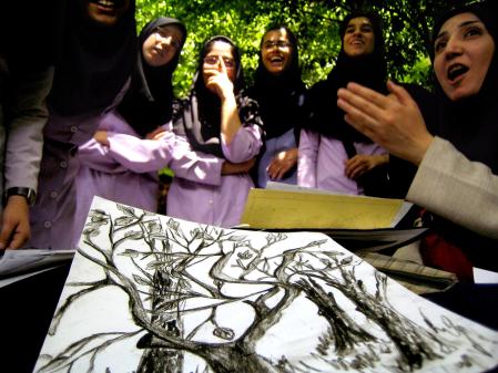 photograph by xavier cervera 10/05/2006 a secondary school students -during plastic arts subject, outdoor- in a park just next to an esfahan city landmark, iran