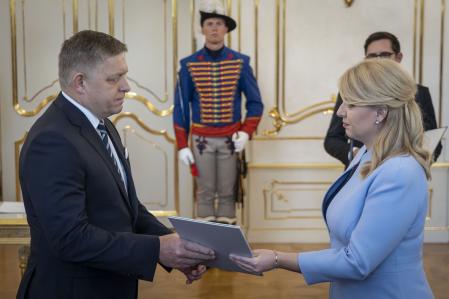 Slovakia's President Zuzana Caputova (R) hands over a document to Robert Fico at the Presidential Palace in Bratislava, Slovakia, on October 25, 2023. Slovakia's presidentappointed a new coalition government led by populist Robert Fico, who has teamed up with a pro-Russian party. (Photo by TOMAS BENEDIKOVIC / AFP)