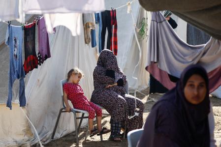 Palestinians, who fled their houses amid Israeli strikes, take shelter at a tent camp at a United Nations-run centre, after Israel's call for more than 1 million civilians in northern Gaza to move south, in Khan Younis in the southern Gaza Strip, October 26, 2023. REUTERS/Ibraheem Abu Mustafa
