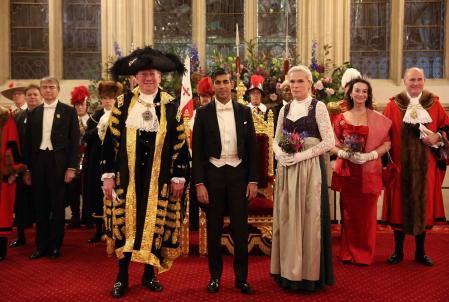 Britain's Prime Minister Rishi Sunak (C) pose for a photograph with the Lord Mayor of the City of London, Michael Mainelli (L) as he attends the Lord Mayor's Banquet at Guildhall in central London on November 13, 2023. The Lord Mayor's Banquet is held in honour of the outgoing Lord Mayor and is hosted by his successor the new Lord Mayor of the City of London. Traditionally, the prime minister makes a major world affairs speech at the event. (Photo by Daniel LEAL / AFP)