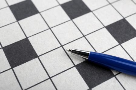 Pen and blank crossword, closeup. Space for text