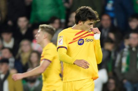 Barcelona's Portuguese forward #14 Joao Felix celebrates scoring his team's third goal during the Spanish League football match between Real Betis and FC Barcelona at the Benito Villamarin stadium in Seville on January 21, 2024. (Photo by CRISTINA QUICLER / AFP)