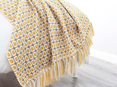 Manta de punto con flecos