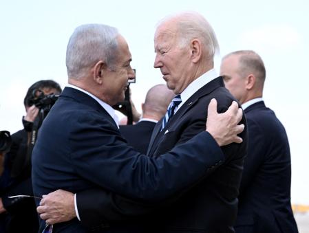 (FILES) Israel Prime Minister Benjamin Netanyahu (L) greets US President Joe Biden upon his arrival at Tel Aviv's Ben Gurion airport on October 18, 2023, amid the ongoing battles between Israel and the Palestinian group Hamas. Biden spoke by phone with Netanyahu April 4, 2024, the White House said, amid growing outrage over an Israeli strike that killed seven aid workers in Gaza. (Photo by Brendan SMIALOWSKI / AFP)