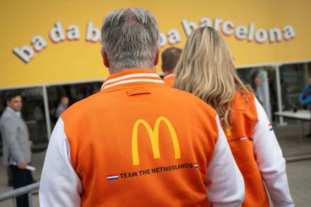 Attendees from The Netherlands team arrive at the venue of the McDonald's Worldwide Convention, held at the Fira Gran Via in Barcelona, on April 8, 2024. More than 14,000 McDonald's franchisees, suppliers, crew members, and employees from across the globe come together for its 2024 annual meeting in Barcelona, marking the first time in the 83-year history of the company that the American multinational fast food giant holds its gathering outside the United States. (Photo by Josep LAGO / AFP)