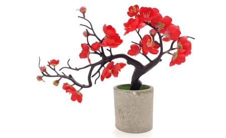 Flor de ciruelo artificial con jarrón