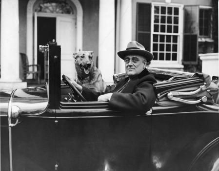 Portrait of American President Franklin Delano Roosevelt (1882 - 1945) as he sits behind the wheel of his car outside of his home in Hyde Park, New York, mid 1930s. (Photo by FPG/Getty Images)