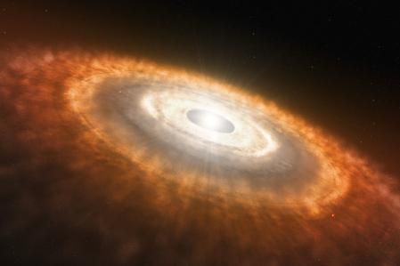 Las estrellas recién nacidas quedan rodeadas de un disco de materia que alimenta la formación de planetas