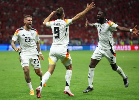 Soccer Football - Euro 2024 - Group A - Switzerland v Germany - Frankfurt, Germany - June 23, 2024 Germany's Niclas Fullkrug celebrates scoring their first goal with Robert Andrich and Antonio Rudiger REUTERS/Thilo Schmuelgen