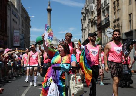 People take part in the 2024 Pride Parade on its way through Trafalgar Square in London, Britain, June 29, 2024. REUTERS/Isabel Infantes