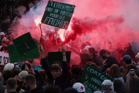 People attend a demonstration after partial results in the second round of the early French parliamentary elections,  in Nantes, France, July 7, 2024. The slogan reads 