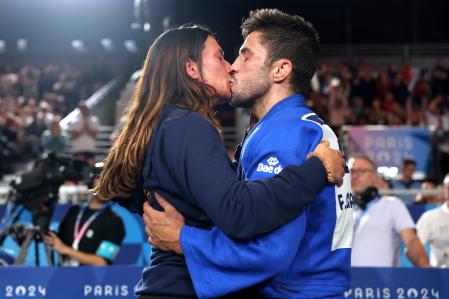 PARIS, FRANCE - JULY 27: Francisco Garrigos of Spain kisses his partner after winning the bronze medal during the Men -60 kg Contest for Bronze Medal B match between Giorgi Sardalashvili of Georgia and Francisco Garrigos of Spain on day one of the Olympic Games Paris 2024 at Champs-de-Mars Arena on July 27, 2024 in Paris, France. (Photo by Buda Mendes/Getty Images)