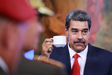 CARACAS, VENEZUELA - AUGUST 2: President Nicolas Maduro holds a cup before a press conference after testifying before the electoral chamber at the main headquarters of the Supreme Court of Justice (TSJ) on August 2, 2024 at the Miraflores presidential palace in Caracas, Venezuela. Nicolas Maduro was declared as winner of the 2024 presidential election by the National Electoral Council while opposition leader Maria Corina Machado and candidate Edmundo Gonzalez claimed that the final result was not what Venezuelans decided during the election. Maduro requested the Supreme Tribunal of Justice to investigate the election to confirm his victory. (Photo by Jesus Vargas/Getty Images)