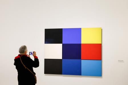 Paris (France), 03/05/2024.- A visitor takes a photograph of an artwork entitled 'Mediterranee, 1951-1952' (R) by American painter and sculptor Ellsworth Kelly on display as part of 'Ellsworth Kelly. Shapes and Colors, 1949-2015' exhibition in The Louis Vuitton Foundation, in Paris, France, 03 May 2024. The exhibition runs from 04 May until 09 September 2024. (Francia) EFE/EPA/MOHAMMED BADRA