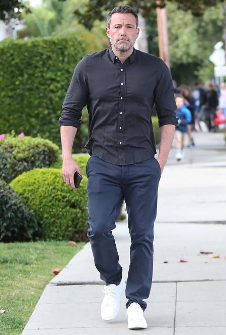 Ben Affleck strolling with his morning coffee in Los Angeles Pictured: Ben Affleck Ref: SPL5153910 030320 NON-EXCLUSIVE Picture by: ENT / SplashNews.com Splash News and Pictures USA: +1 310-525-5808 London: +44 (0)20 8126 1009 Berlin: +49 175 3764 166 photodesk@splashnews.com World Rights, No France Rights, No Italy Rights, No Japan Rights spotted,out an about,coffee,iced coffee,green shirt,button up,khakis,sneakers,walk,walking,Ben Affleck
