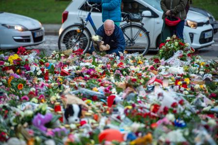 MAGDEBURG, GERMANY - DECEMBER 23: A member of the public lays some flowers and a teddy bear at Johanniskirche near the now closed Christmas market on December 23, 2024 in Magdeburg, Germany. The terror attack at the busy Magdeburg Christmas market has left five people dead, including a nine-year-old boy, and over 200 injured. The attacker, identified as Taleb A., is a Saudi national who has been living in Germany since 2006 and worked as a psychotherapist. In social media posts he was critical of Germany but also of Islam and the Islamization of Germany. He expressed support for policies of the far-right Alternative for Germany (AfD). (Photo by Craig Stennett/Getty Images)