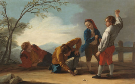 Niños jugando a la peonza.