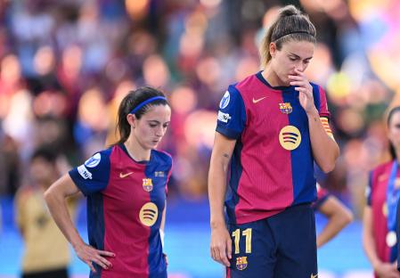 LISBON, PORTUGAL - MAY 24: Alexia Putellas and Aitana Bonmati of FC Barcelona look dejected following defeat in the UEFA Women's Champions League final match between Arsenal WFC and FC Barcelona at Estadio Jose Alvalade on May 24, 2025 in Lisbon, Portugal. (Photo by David Ramos/Getty Images)