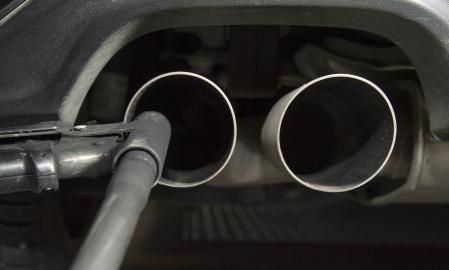 (FILES) A hose for an emission test is fixed in the exhaust pipe of a Volkswagen Golf 2,0 litre diesel car at the Technical Inspection Agency in Ludwigsburg, southwestern Germany, on August 7, 2017. A German court on May 26, 2025 handed four former Volkswagen managers sentences over their part in the 